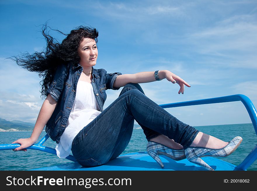 A  young woman on a yacht at sea