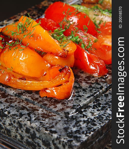 Vegetables on a marble plate. Tomatoes, peppers. Closeup. Vegetables on a marble plate. Tomatoes, peppers. Closeup