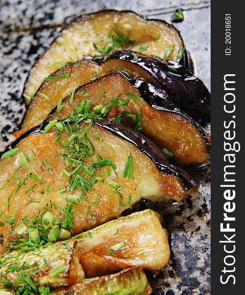 Egg-plants on a marble plate. Closeup