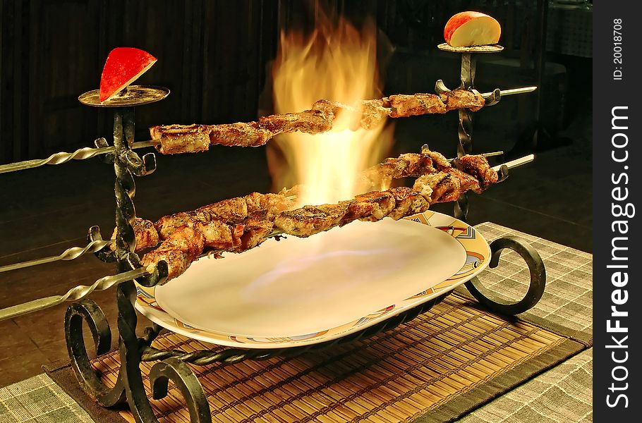 Barbecue on table in restaurant. With fire