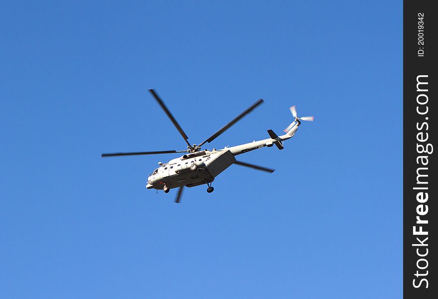 Helicopter in the air, easy to isolate from blue sky