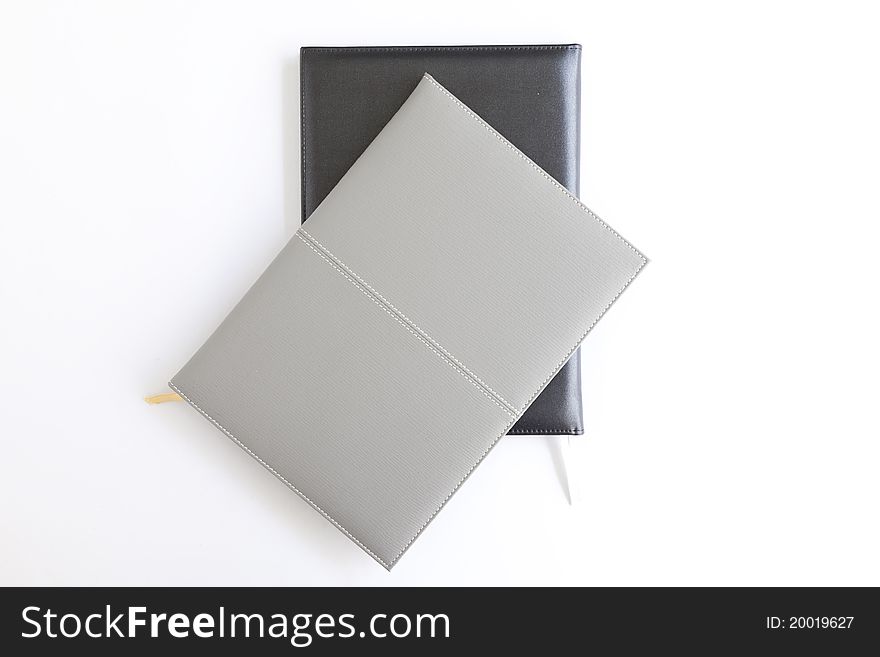 Small black and Gray notebook with blank cover /Over White. Small black and Gray notebook with blank cover /Over White.