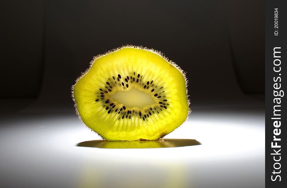 Fruits - kiwi, on the table with dark background with studio liht