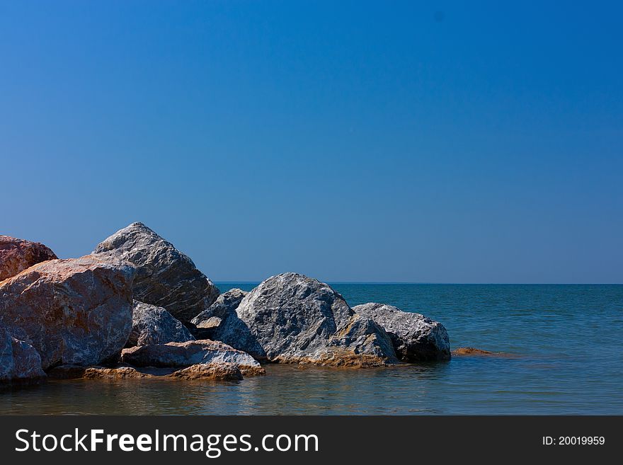 Stones in sea,summer day at beach