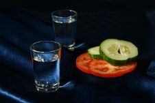 Two Drinks And Vegetables In The Cold Dark Royalty Free Stock Images