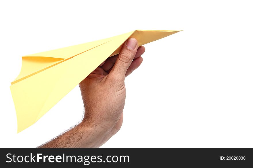 Closeup of a man hand throwing a yellow paper plane