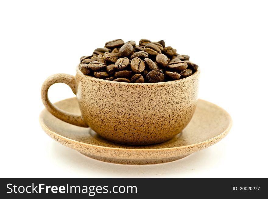 A Coffee Cup Full of Coffee Beans on the White Background