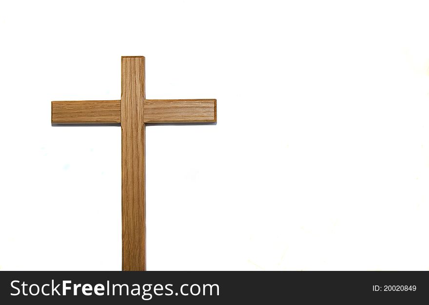Wooden cross isolated against white background with copy space. Wooden cross isolated against white background with copy space