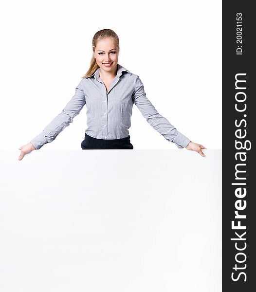 Businesswoman standing behind blank whits billboard. Isolated over white