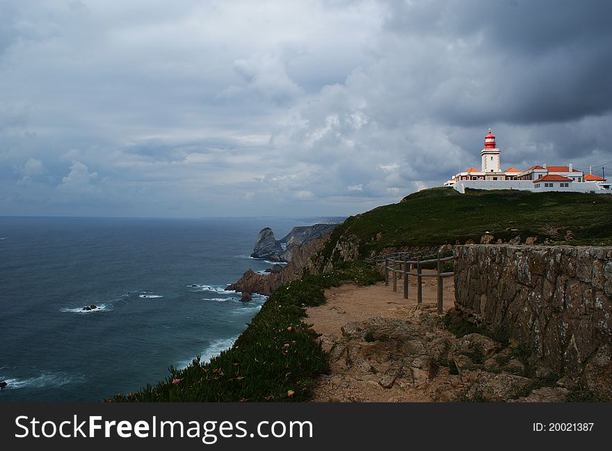 Cabo da Roca , The most extreme point of Europe, the Portuguese coast, beacon on coast, stone rocks, rocks over water