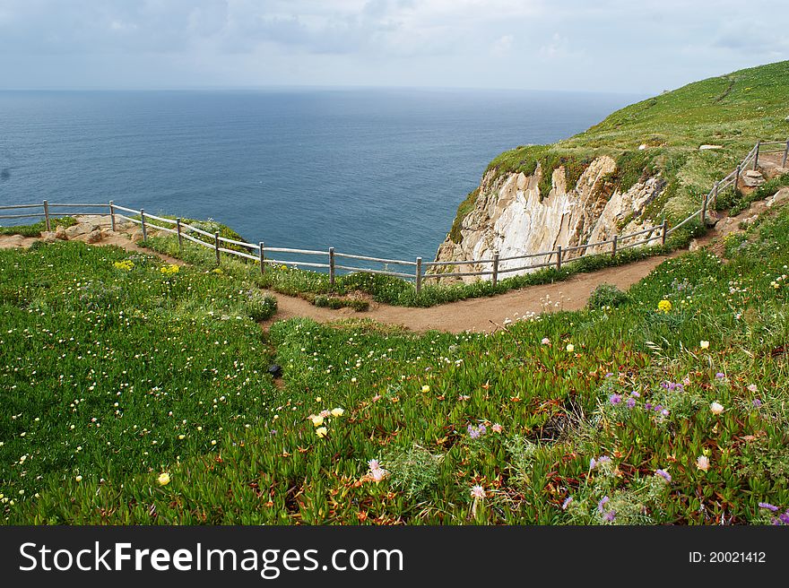 Cabo da Roca , The most extreme point of Europe, the Portuguese coast, beacon on coast, stone rocks, rocks over water