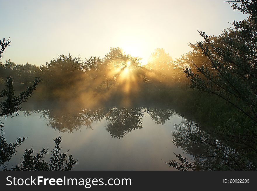 Sunrise, morning fog, sun beams. Sunrise, morning fog, sun beams