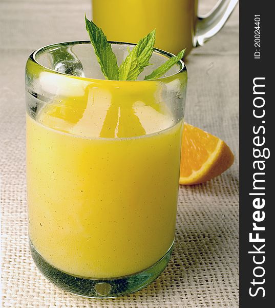 Orange juice with mint pitcher and glass