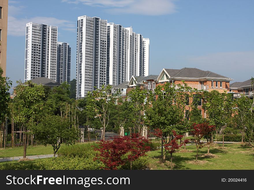 Blue sky and sun, the summer high-rise buildings, residential villas, green garden, a beautiful living environment. Blue sky and sun, the summer high-rise buildings, residential villas, green garden, a beautiful living environment.