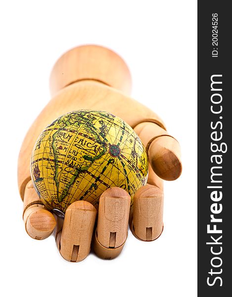 Global in wooden hand, on white isolated background