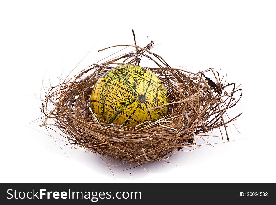 Birds nest with global inside, isolated on white.
