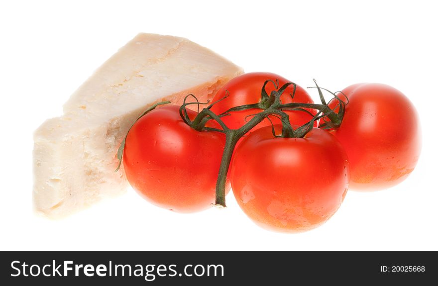 Tomatoes and cheese parmesan isolated on white.