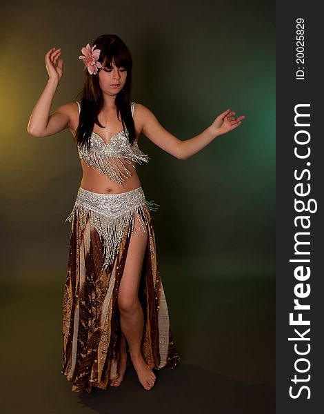 Belly dancer in action, performing on music