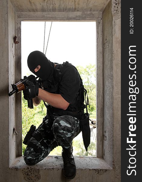 Soldier In Mask Entering The Window With Ak-47