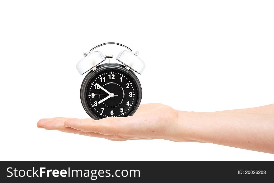 Woman with an alarm clock in a hand. Isolated on white background