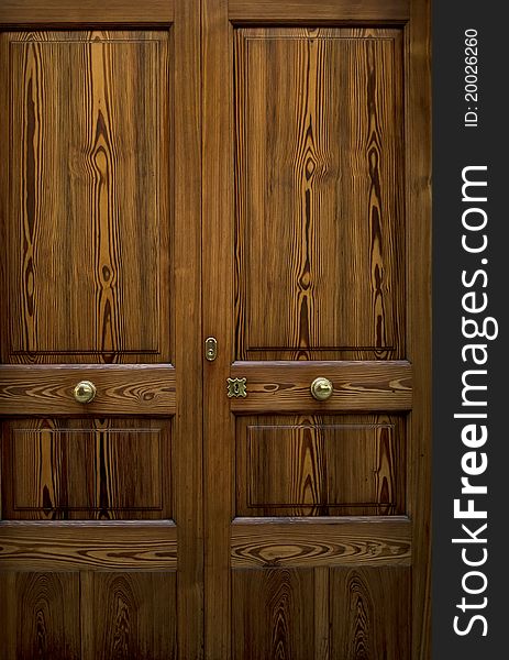 Details of golden ornaments on a wooden door, raw. Details of golden ornaments on a wooden door, raw