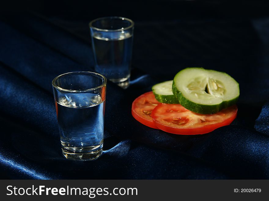 Two drinks and vegetables in the cold dark