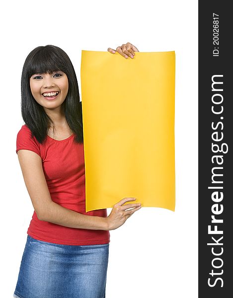 Asian woman in red shirt holding yellow sign/banner isolated over white background. Asian woman in red shirt holding yellow sign/banner isolated over white background