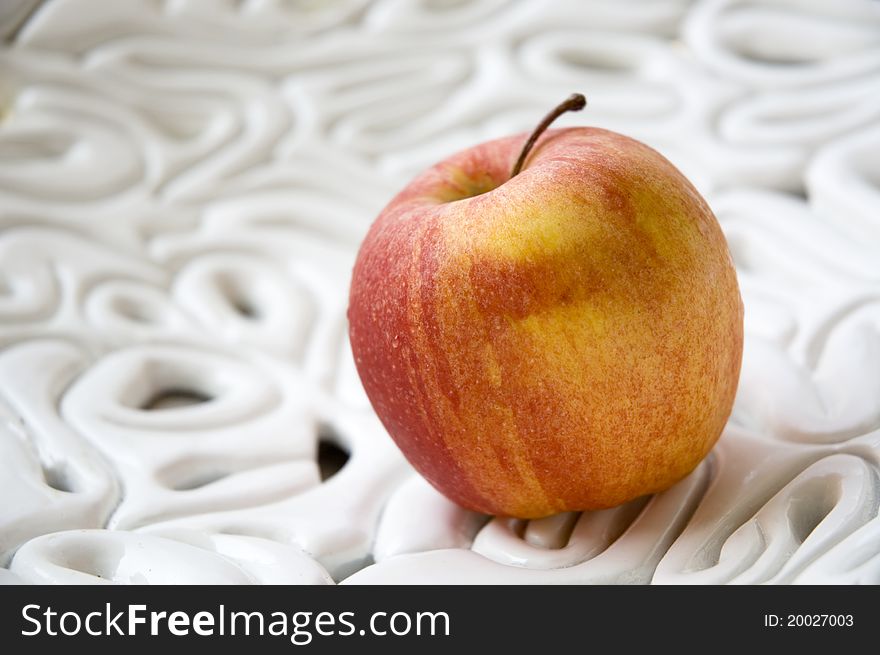 Apple on texture white bowl. Apple on texture white bowl