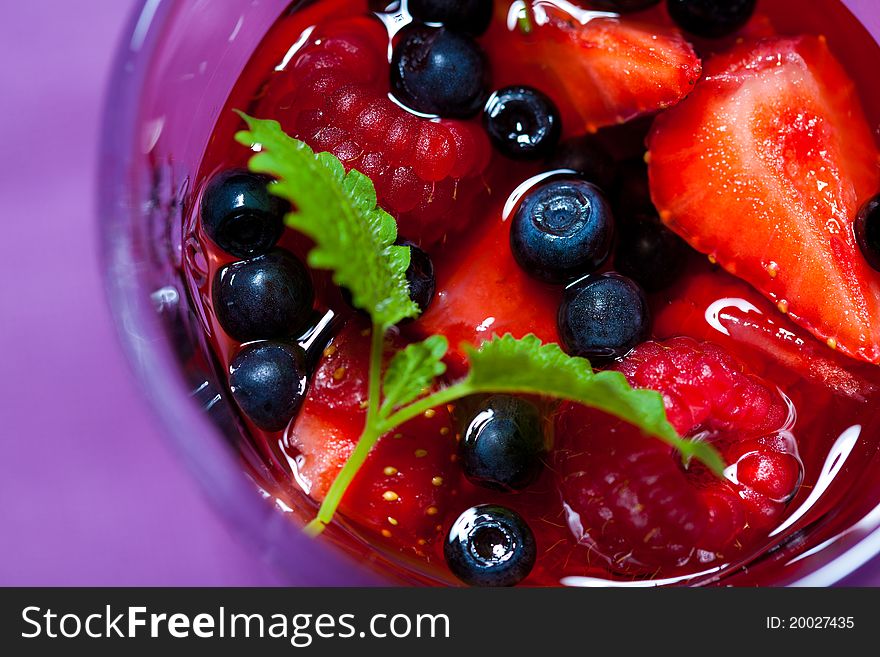 Closeup of cold fruit jelly in a glass. Closeup of cold fruit jelly in a glass