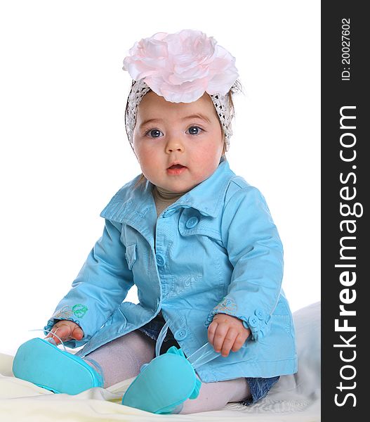 Small baby wearing a blue coat isolated on white. Small baby wearing a blue coat isolated on white