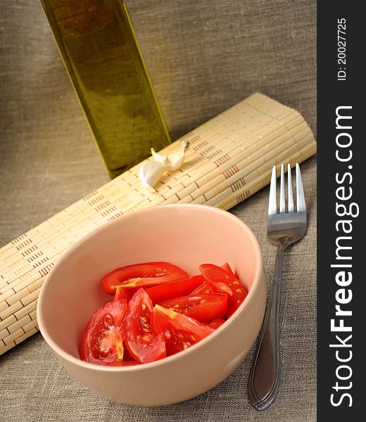 A salad of tomato, olive oil and garlic. A salad of tomato, olive oil and garlic