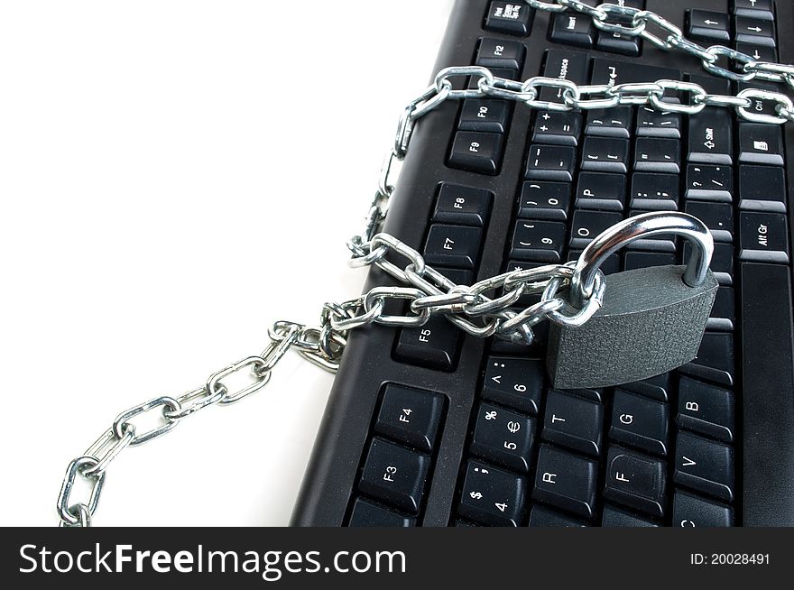 Computer keyboard and lock isolated on a white background