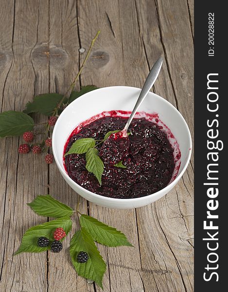 Blackberry  jam with a silver spoon