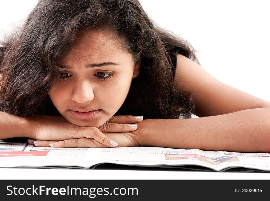 Indian female reading newspaper
