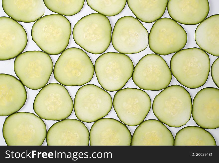 Cucumber slices forming geometric background. Cucumber slices forming geometric background