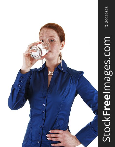 A young healthy woman standing in the studio and drinking a glass
of water, for white background. A young healthy woman standing in the studio and drinking a glass
of water, for white background.