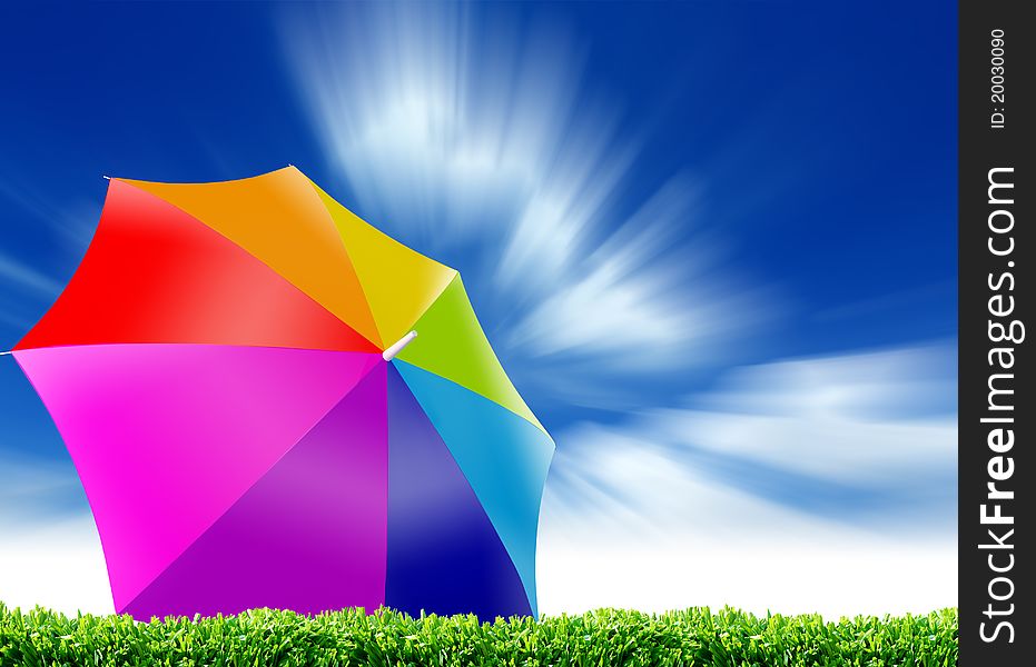 Rainbow umbrella and blue sky background.