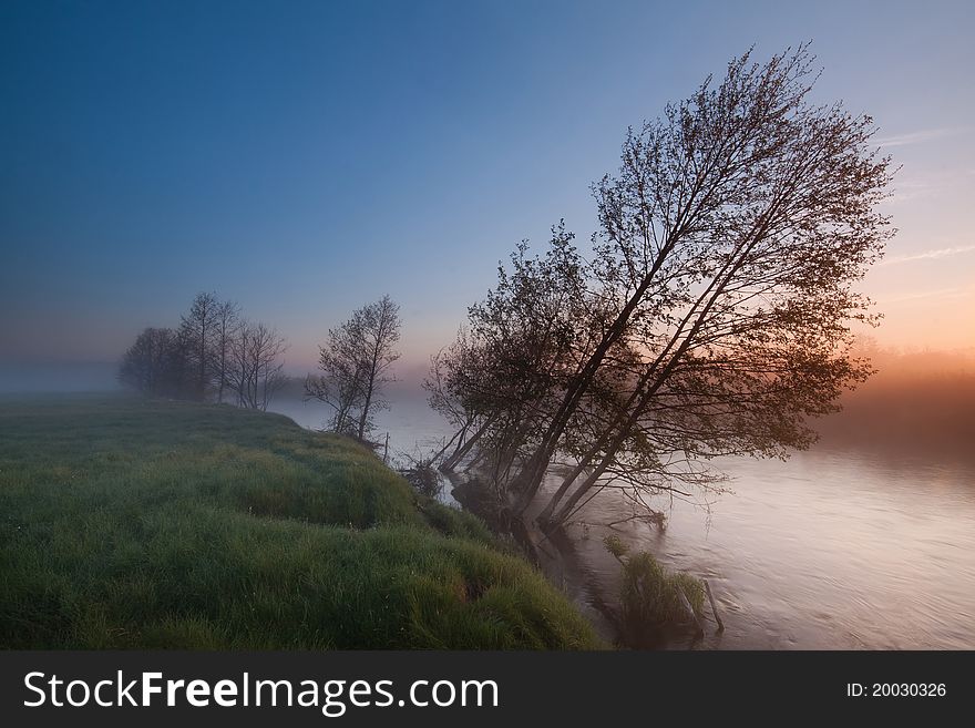 Colorful, misty sunrise on the river. Colorful, misty sunrise on the river.