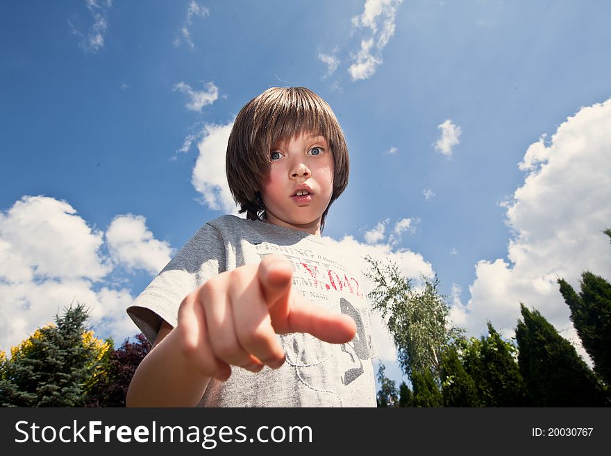 Boy with surprised face, pointing at something. Boy with surprised face, pointing at something