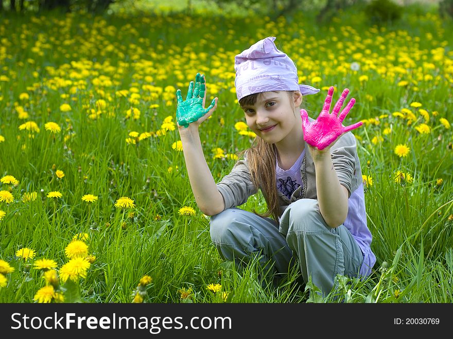 Child painting with paints on the meadow. Child painting with paints on the meadow