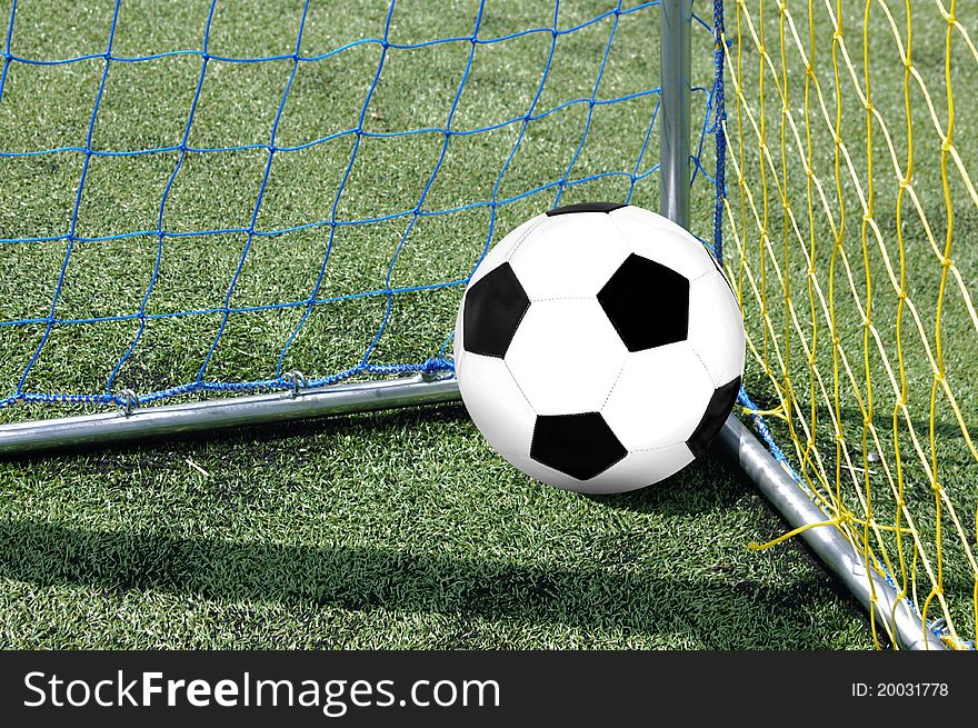 The foot ball in mesh of goal