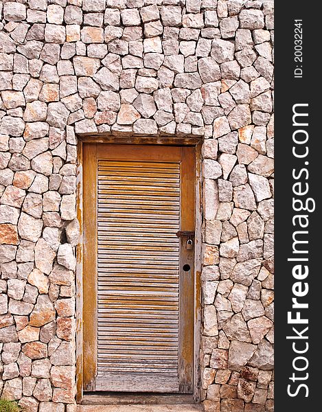Surface texture of stone wall decoration and wooden door. Surface texture of stone wall decoration and wooden door