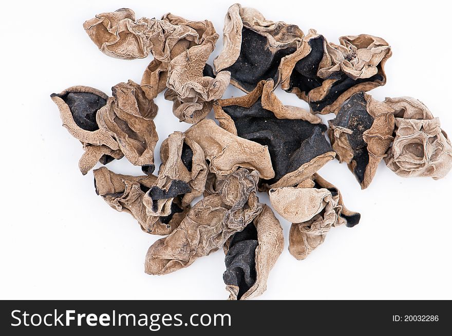 Dried chinese delicacy black Muer (Cloud ear fungus) isolated over white. Dried chinese delicacy black Muer (Cloud ear fungus) isolated over white