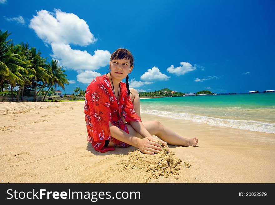 Beauty girl enjoying the sand beach on sunny day