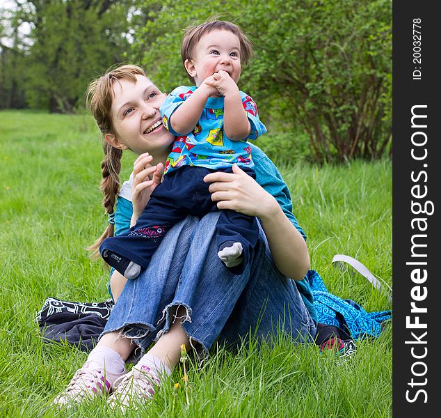 Young mother with son relaxing outdoor. Young mother with son relaxing outdoor