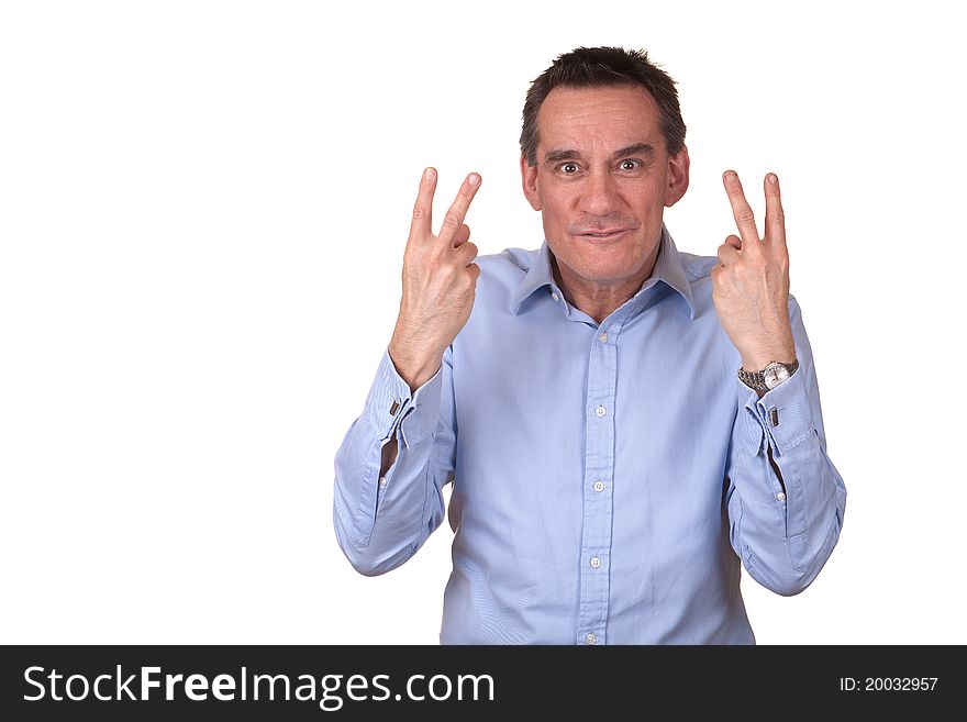 Attractive Frustrated Man in Blue Shirt Giving Two Fingers Sign. Attractive Frustrated Man in Blue Shirt Giving Two Fingers Sign