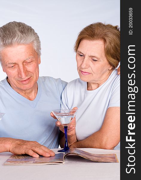 Happy elderly couple on a white background. Happy elderly couple on a white background