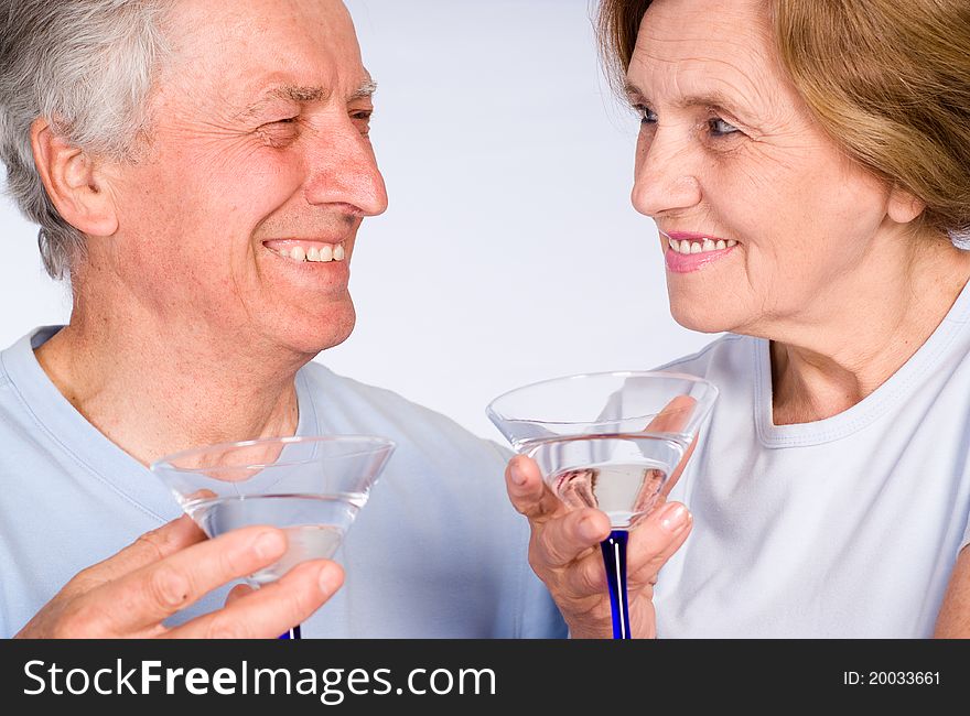 Aged couple with glass