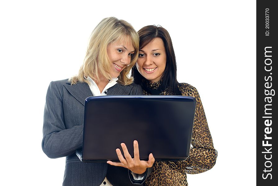 Two young pretty women with a laptop