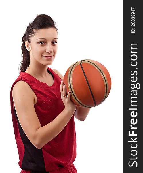 Pretty brunette woman holding basketball in hand and smiling